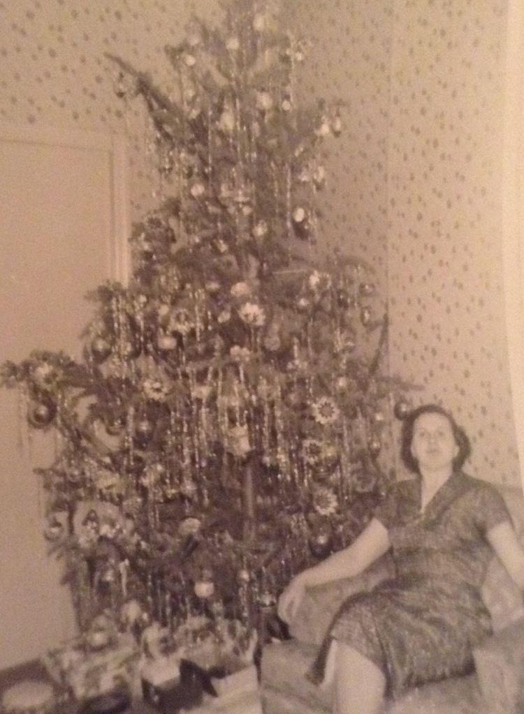 My mother in front of the Christmas Tree
